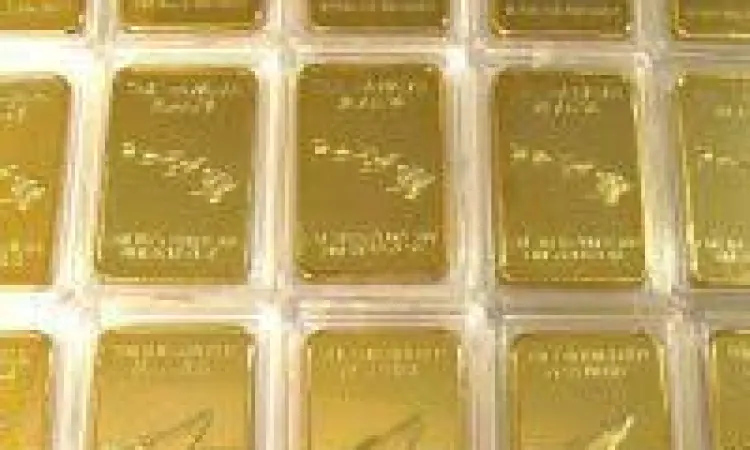 Timbangan emas digital menunjukkan satuan troy ounce